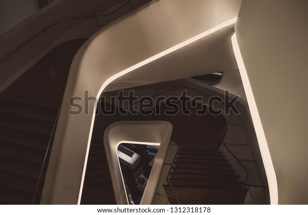 Dim staircase with neon\
lighting