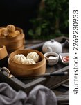 Dim sum, pao, sosis roll in bamboo basket
