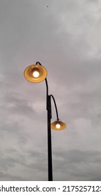 Dim Yellow Street Light On A Cloudy Day