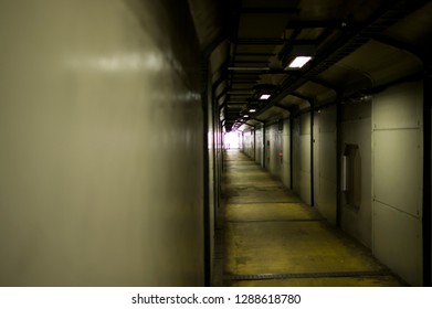 Dimly lit corridor, small room under the highway, old dormitory building, dilapidated decoration inside the hotel - Powered by Shutterstock