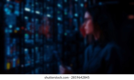 A dimly lit scene features two indistinct figures standing before a vibrant, out-of-focus display of colorful lights, creating a mysterious atmosphere.
