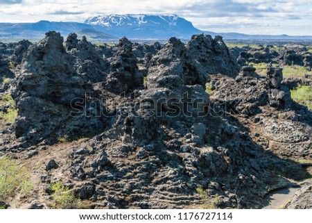 Dimmuborgir lava field, Myvatn area - Iceland. The Dimmuborgir area is composed of various volcanic caves and rock formations, reminiscent of an ancient collapsed citadel.