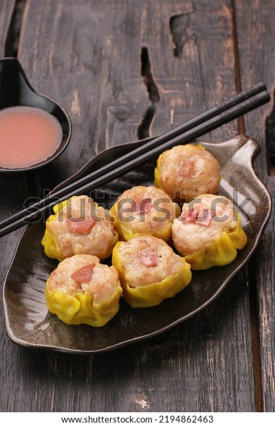 Dimsum is a term from\
the Cantonese language and means snack. Usually dim sum is eaten as\
breakfast or sarsi.