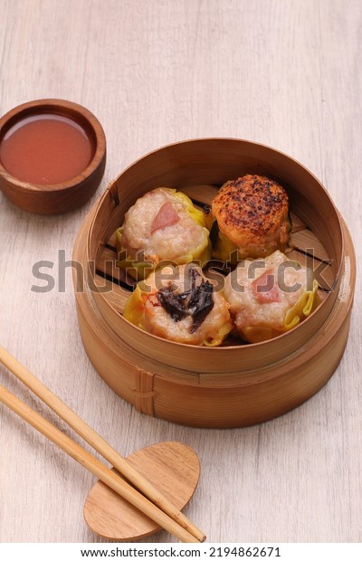 Dimsum is a term from\
the Cantonese language and means snack. Usually dim sum is eaten as\
breakfast or sarsi.