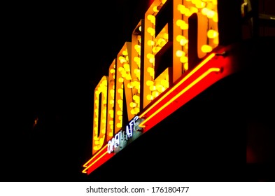 A diner sign made up of neon lights - Powered by Shutterstock