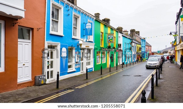 Dingle, Kerry/ Ireland - September 22, 2018:\
brightly colored buildings and businesses on a street in Dingle,\
Kerry, Ireland\
