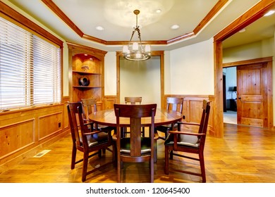 Dining luxury  room with wood molding and floor.
