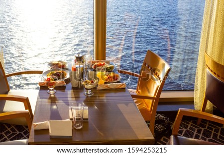 Dining Room Buffet aboard the abstract luxury cruise ship. breakfast with sea view