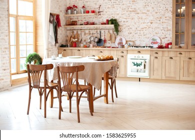 Dining Room In Cottage Style. Dining Room Interior With Kitchen And Brick Walls. Stylish Kitchen Interior With Wooden Round Table And Chairs In Rustic Style. Cozy Country House. Scandinavia