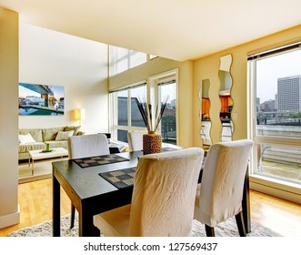 DIning Room Interior In Modern City Apartment With High Loft Ceiling.