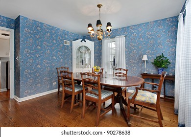 Dining Room In Traditional Home With Blue Wallpaper