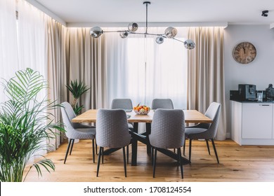 Dining Room With Wooden Table And Floor In Modern Apartment. Interior Design