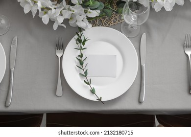 Dining table with beautiful setting and blank card