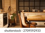 Dining table with chairs in kitchen at night