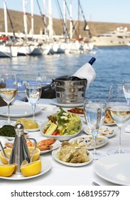 Dining Table, Fish And Wine Next To The Sea