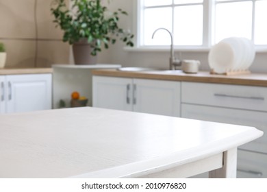 Dining table in interior of modern kitchen - Shutterstock ID 2010976820