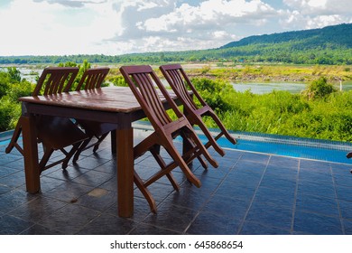 dining table with many chairs with random natural view