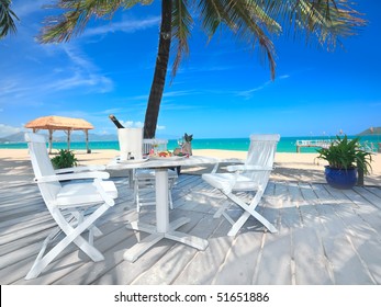 Dining Table On The Beach Close To The Ocean