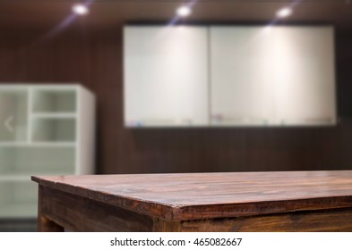 Dining table on blurred brown kitchen interior background.