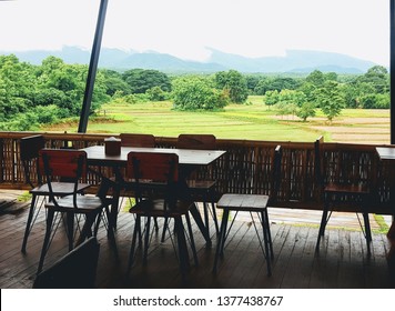 Dining table with rice field view.