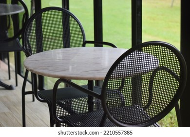 Dining Table Set, Design, Round Shape,Elegant Metal Garden Furniture On Terrace With Tables And Chairs.concept Design,home Decorate.selective Focus.