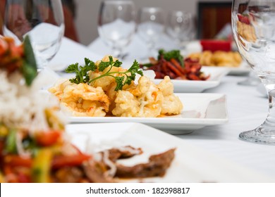 Dining Table Set Up With Different Kind Of Dishes