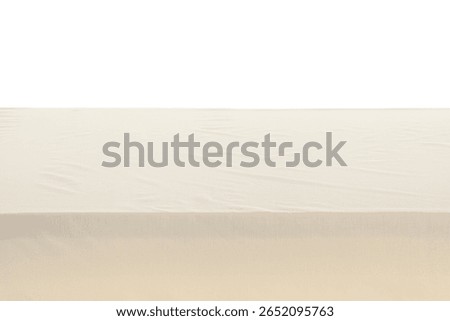 Dining table with stylish beige tablecloth isolated on white background, closeup
