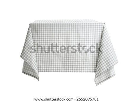 Dining table with stylish checkered tablecloth isolated on white background