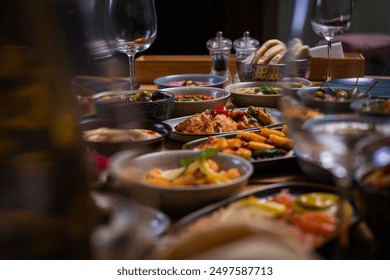Dining Table with various dishes served with wine