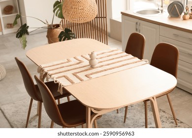 Dining table with vase in light kitchen