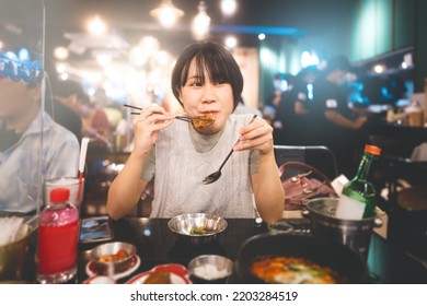 Dinner Couple Date At Indoor Restaurant Concept. Portrait Happy Smile Young Adult Southeast Asian Woman Holding Fried Chicken At Korean Meal. Foodie People Lifestyle.