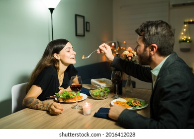 Dinner Is Delicious. Romantic Boyfriend Made A Fancy Dinner At Home And Enjoying An Elegant Date With Her Beautiful Girlfriend