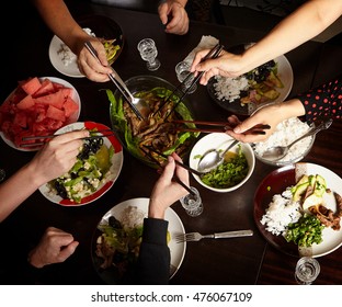 Dinner With Friends At The Table. View From Above. Chinese Food With Chopsticks. Fish, Meat, Pork, Potatoes.