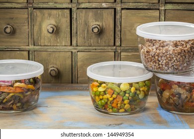 Dinner Leftovers (buckwheat Kasha, Vegetables, Stir Fry)  In Glass  Containers With Drawer Cabinet In Background