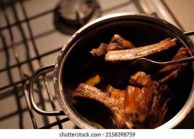 Dinner Leftovers Pork Ribs In A Frying Pan From Above In An Old Kitchen