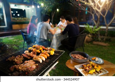 Dinner Party, Barbecue And Roast Pork At Night