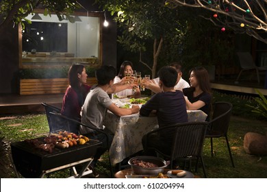 Dinner Party, Barbecue And Roast Pork At Night