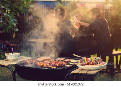 Dinner party, barbecue and roast pork at night
