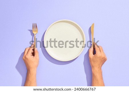 Similar – Image, Stock Photo Hand with cutlery and a bowl of green salad. Top view.
