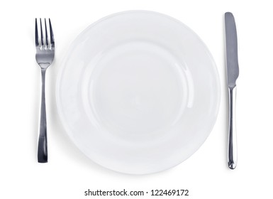 Dinner Place Setting. White Plate With Fork And Knife Isolated On White Background