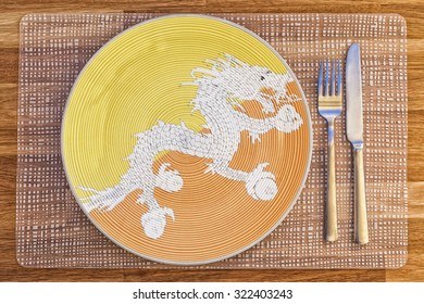 Dinner Plate With The Flag Of Bhutan On It For Your International Food And Drink Concepts.