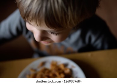 Dinner In A Poor Family. Food For A Poor Child. The Problem Of Poverty And Lack Of Food In The World. Poor But Happy Child.