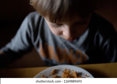 Dinner In A Poor Family. Food For A Poor Child. The Problem Of Poverty And Lack Of Food In The World. Poor But Happy Child.