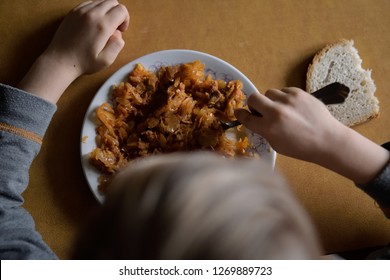 Dinner In A Poor Family. Food For A Poor Child. The Problem Of Poverty And Lack Of Food In The World. Poor But Happy Child.