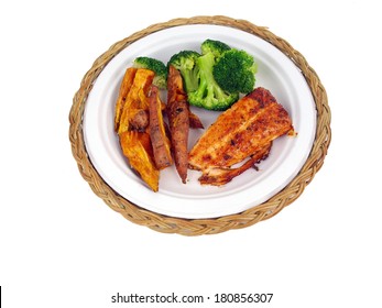 A Dinner Of Salmon, Sweet Potato Fries And Brocolli Isolated On White Background