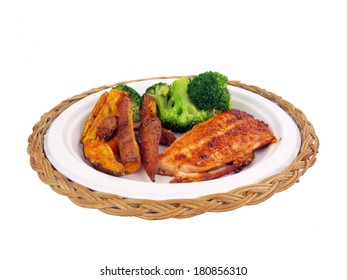 A Dinner Of Salmon, Sweet Potato Fries And Brocolli Isolated On White Background