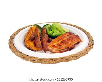 A Dinner Of Salmon, Sweet Potato Fries And Brocolli Isolated On White Background