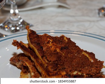 Dinner Time At Home With Friends And Family. A Typical First Course Of Italian Cuisine, Lasagna, Made With Minced Meat And Tomato Sauce.