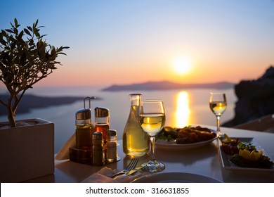 Dinner for two and the sea sunset in Santorini, Greece
