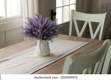 Dinning Table With Lavender Flowers In A Vase